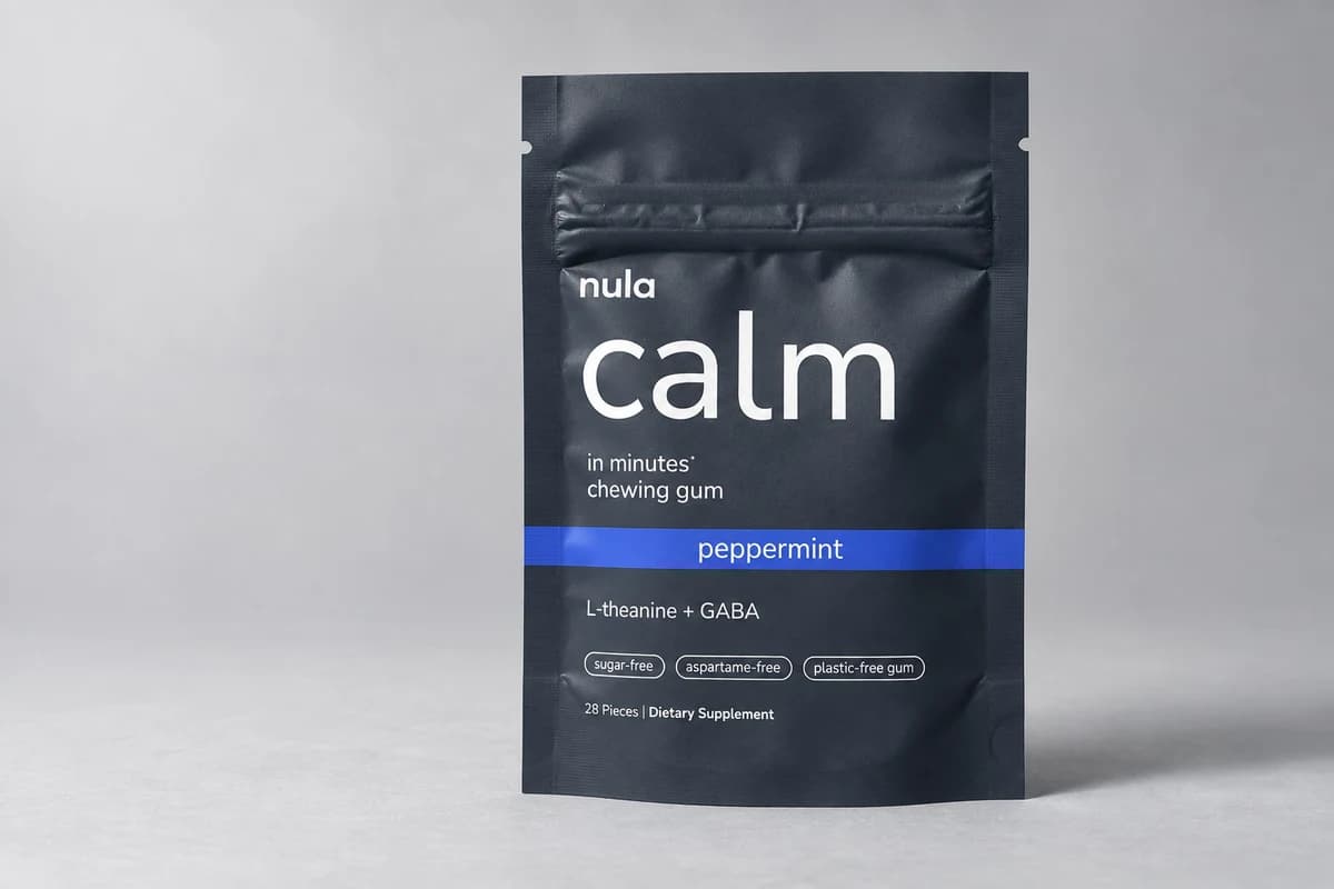 A pouch of Nula calm gum standing on a grey studio surface